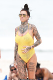 Jemma Lucy pokies in yellow swimsuit on the beach in Sydney - February 28, 2019