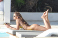 Izabel Goulart in yellow bikini on vacation in Mykonos - June 25, 2019