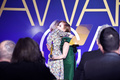 Isla Fisher cleavage in green dress at 2019 Australians In Film Awards in Los