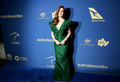 Isla Fisher cleavage in green dress at 2019 Australians In Film Awards in Los