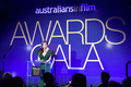 Isla Fisher cleavage in green dress at 2019 Australians In Film Awards in Los