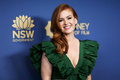Isla Fisher cleavage in green dress at 2019 Australians In Film Awards in Los