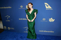 Isla Fisher cleavage in green dress at 2019 Australians In Film Awards in Los