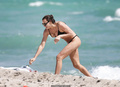 Irina Shayk nipple slip in black bikini at the beach in Miami - March 07, 2019