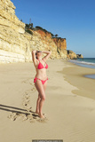 Imogen Thomas in red bikini on a beach in Portugal - January 25, 2019