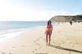Imogen Thomas in red bikini on a beach in Portugal - January 25, 2019