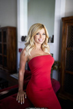 Donna D'Errico in tight red dress at home photoshoot - May 2019