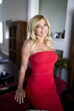 Donna D'Errico in tight red dress at home photoshoot - May 2019