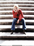 English singer and songwriter Dido in jeans and red blouse for Pat Pope