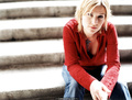 English singer and songwriter Dido in jeans and red blouse for Pat Pope