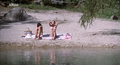 Jennifer Connelly and Debra Cole nude on a beach