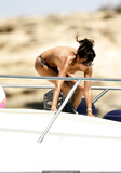 Danielle Bux topless on a yacht in Ibiza paparazzi photo
