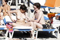 Daisy Lowe changing on the beach shows her nude boos