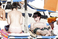 Daisy Lowe changing on the beach shows her nude boos