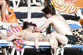 Daisy Lowe changing on the beach shows her nude boos