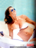 Italian journalist and television host Cristina Parodi sunbathing topless in