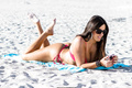 Claudia Romani in red bikini on the beach in South Beach - May 19, 2019