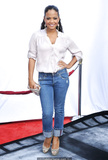Christina Milian in jeans and white blouse