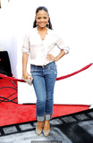 Christina Milian in jeans and white blouse