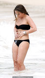 Chloe Green in black bikini on a beach in Babrados, December 17