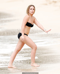 Chloe Green in black bikini on a beach in Babrados, December 17