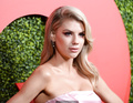 Blonde Charlotte McKinney in pink dress at red carpet