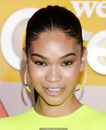 Chanel Iman in short lemon dress, shows her long legs