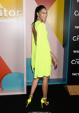 Chanel Iman in short lemon dress, shows her long legs