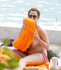Caroline Flack sunbating topless on a beach paparazzi photos