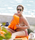 Caroline Flack sunbating topless on a beach paparazzi photos