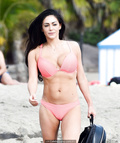 Casey Batchelor in pink bikini on the beach in Spain