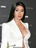 Cardi B legs and cleavage at Fashion Nova x Cardi B Collection Launch Event in
