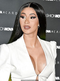 Cardi B legs and cleavage at Fashion Nova x Cardi B Collection Launch Event in