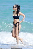 Cara Santana in black bikini on the beach in Miami - November 07, 2019