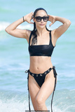 Cara Santana in black bikini on the beach in Miami - November 07, 2019