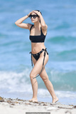 Cara Santana in black bikini on the beach in Miami - November 07, 2019