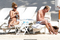 Billie Piper relaxing topless at the beach - April 22, 2008