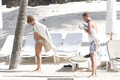 Billie Piper relaxing topless at the beach - April 22, 2008