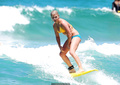 Bonnie Sveen in bikini surfing at Bondi Beach - January 15, 2015