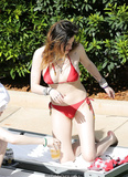 Bella Thorne in red bikini with Dani in black at the pool in Miami - March 13,