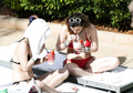 Bella Thorne in red bikini with Dani in black at the pool in Miami - March 13,