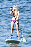 Blonde Ava Sambora paddle boarding in bikini in Hawaii