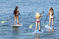 Blonde Ava Sambora paddle boarding in bikini in Hawaii