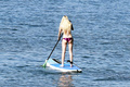 Blonde Ava Sambora paddle boarding in bikini in Hawaii