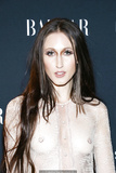 Anna Cleveland braless in see through dress at Harper’s Bazaar Icons party at
