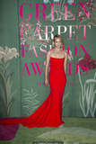 Amber Valletta in red dress at Green Carpet Fashion Awards in Milan - September