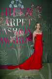 Amber Valletta in red dress at Green Carpet Fashion Awards in Milan - September