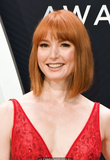 Redhead Alicia Witt sexy in red dress