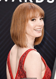 Redhead Alicia Witt sexy in red dress