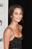 Alicia Vikander posing at awards ceremony
